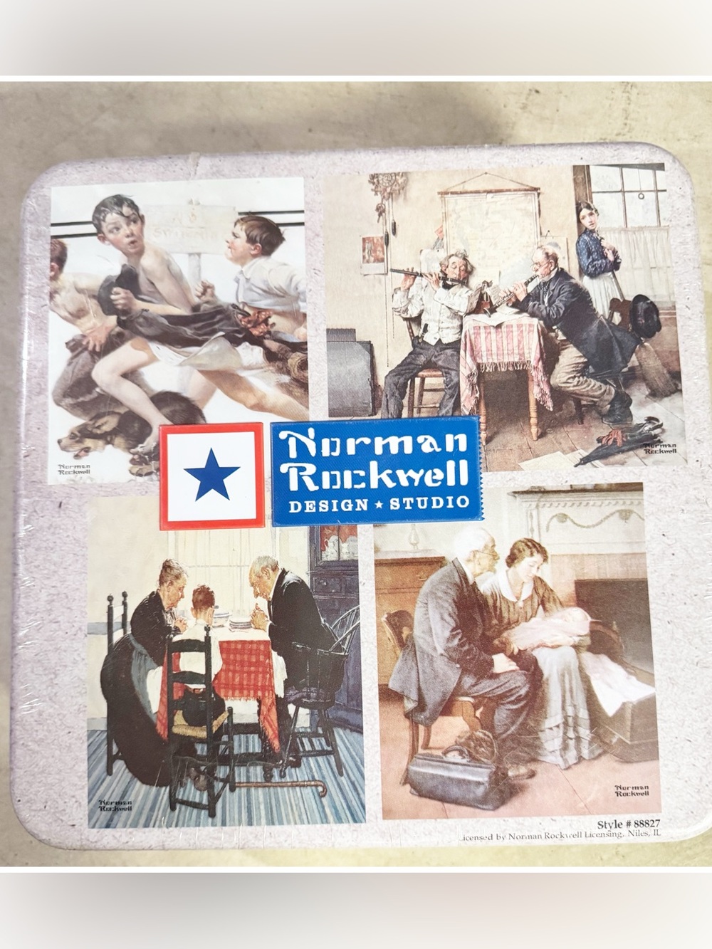 Norman Rockwell Design Studio(4) 500-piece puzzles in decorative tin Style#88827